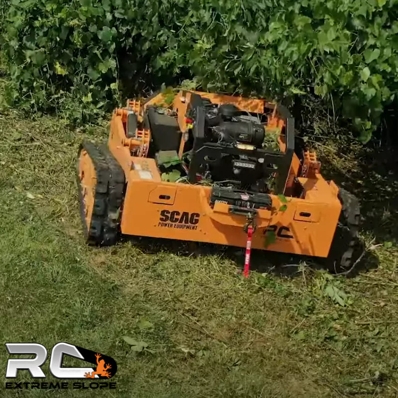 Scag RC Extreme Slope™ Mower in action, tackling dense vegetation and uneven terrain with its powerful 37 HP Vanguard BIG BLOCK™ engine and hybrid 7.4kw alternator