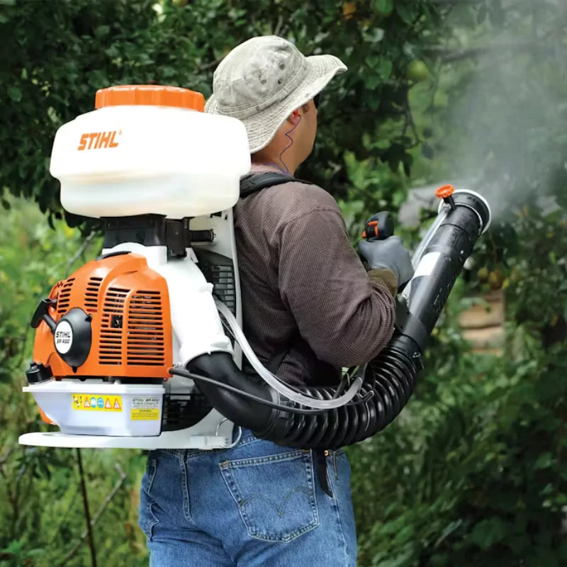 STIHL SR 450 Backpack Sprayer in Action – Demonstrating the sprayer’s 542 CFM air volume for efficient pest control and fertilization in a garden setting.