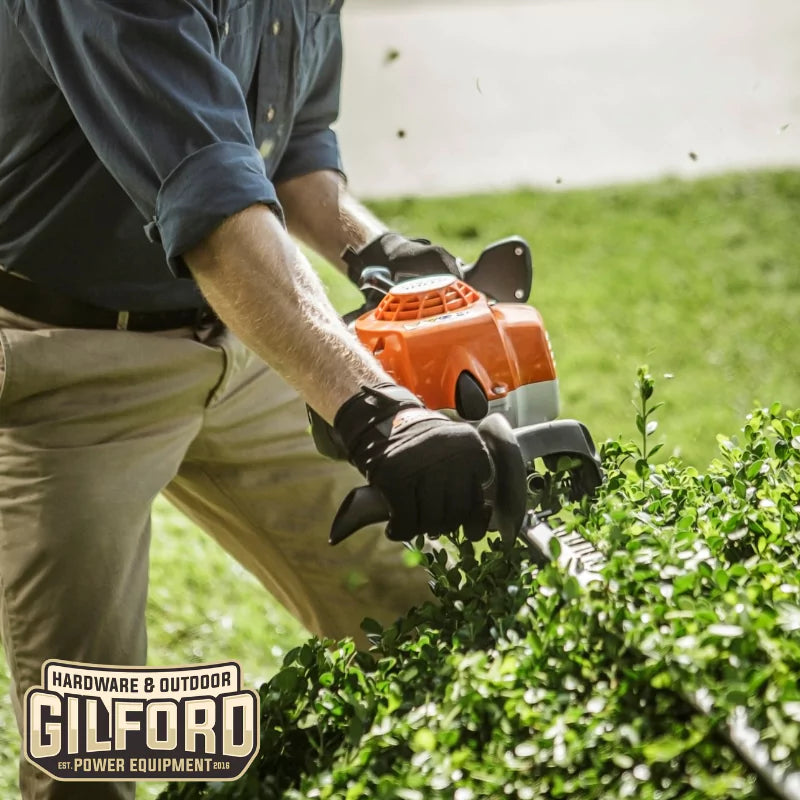 A homeowner maintaining hedges with the STIHL HS 87 T hedge trimmer, illustrating its versatility for both residential and commercial use.