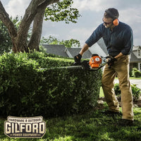 Thumbnail for The STIHL HS 87 T hedge trimmer being used on dense shrubbery, showcasing its precision and power for demanding tasks.